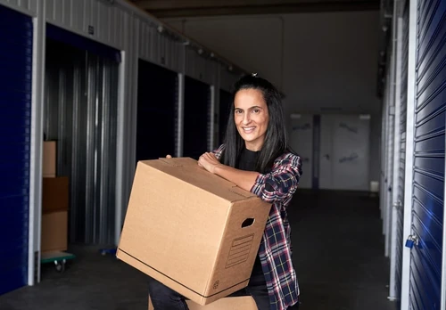 Woman moving boxes